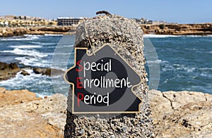 SEP symbol. Concept words SEP Special enrollment period on beautiful black chalk blackboard. Beautiful stone beach blue sea