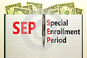 SEP symbol. Concept words SEP Special enrollment period on beautiful white note. Dollar bills. Beautiful white table white