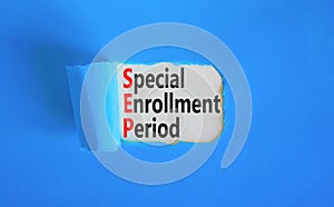 SEP symbol. Concept words SEP Special enrollment period on beautiful white paper. Beautiful blue table blue background. Medical