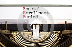 SEP symbol. Concept words SEP Special enrollment period typed on beautiful retro old typewriter. Beautiful white background.