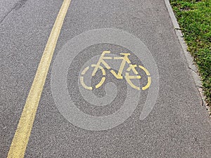 Separate bicycle way and bike sign on asphalt road