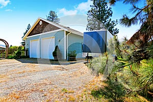 Separate garage building with two doors.