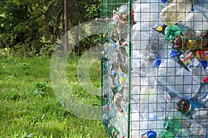 Separate garbage collection of garbage. plastic bottles on green background. waste containers. separate place.