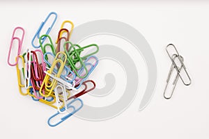 Separate piles of paper clips