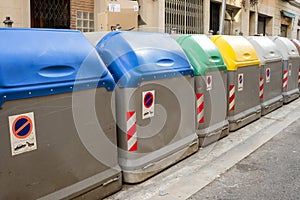 Separated rubbish bins in the street. Recycling. For plastic, organic, paper