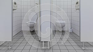 separated toilets at public restroom beside white cabins and open