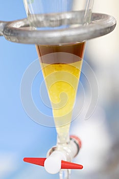 Separating by filtration and evaporation condensation the component substances from liquid mixture in Lab.