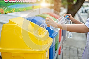 Separating waste plastic bottles into recycling bins is to protect the environment, causing no pollution, reduce global warming,