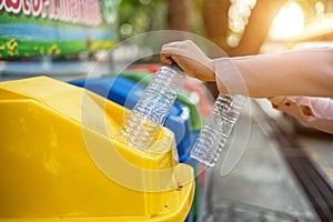 Separating waste plastic bottles into recycling bins is to protect the environment, causing no pollution, reduce global warming,