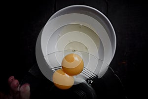 separating the white and the yellow eggs