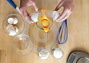 Separating yellow yolks from protein in raw eggs for cake, biscuit and cream