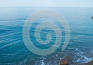 Separation buoys in the sea for safe swimming on the beach