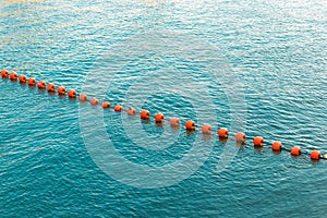 Separation buoys in the sea for safe swimming on the beach