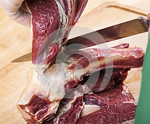Separation of a raw mutton meat with rib