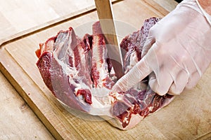 Separation of a raw mutton meat with rib