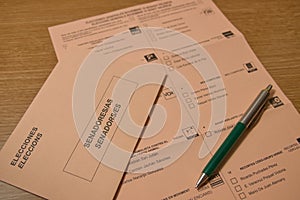 Sepia-colored ballot paper for the Spanish senate next to a pen and an envelope photo