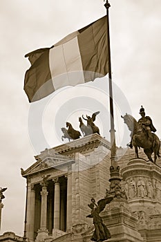 Sepia image of Italian flag flying over the Monument to King Victor Emmanuel II, Rome, Italy, Europe