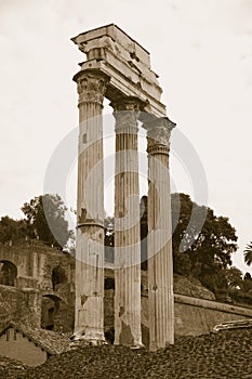 Sepia image of Temple of Castor & Pollux at Roman Forum seen from the Capitol, ancient Roman ruins, Rome, Italy, Europe