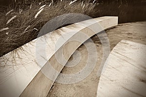 Sepia monotone classic image of white concrete bench in the outdoor garden with nobody imply sad and loneliness.