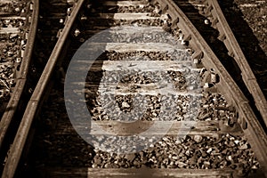 Sepia photo of some old rails retro background