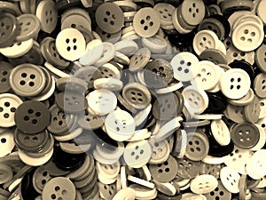 Sepia tone disorderly small sewing buttons background