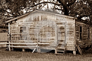 Sepia Toned Old House with Boarded up Door