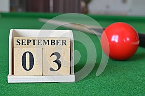 September 03, number cube on snooker table, sport background.