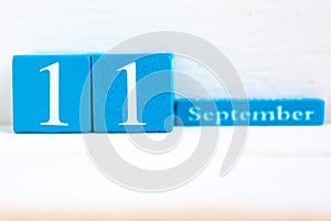 September 11, wooden background.