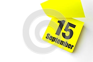 September 15th. Day 15 of month, Calendar date. Close-Up Blank Yellow paper reminder sticky note on White Background. Autumn month