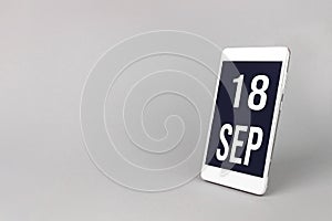 September 18th. Day 18 of month, Calendar date. Smartphone with calendar day, calendar display on your smartphone. Autumn month,