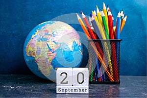 September 20 on the wooden calendar.The twentieth day of the autumn month, a calendar for the workplace. Autumn