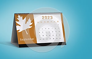 September 2023 Calendar with Leaf Icon Isolated on blue background with space for copy
