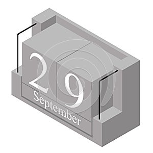 September 29th date on a single day calendar. Gray wood block calendar present date 29 and month September isolated on white