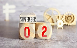 September 2nd. Image of September 2 wooden color calendar on white canvas background.