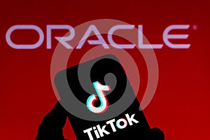 September 21, 2020, Brazil. In this photo illustration a TikTok logo is seen displayed on a smartphone with an Oracle logo on the