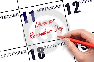 September 11. Hand writing text Libraries Remember Day on calendar date. Save the date.