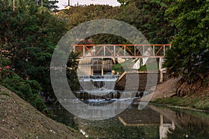 Small waterfall along the river, in the Ecological Park, in Indaiatuba, Brazil photo