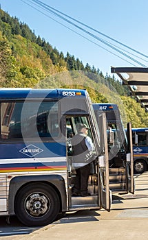 September 14, 2018 - Juneau, Alaska: Tour bus driver waiting for passengers.