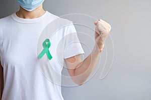 September Ovarian cancer Awareness month, Woman with teal Ribbon color for supporting people living, and illness. Healthcare and