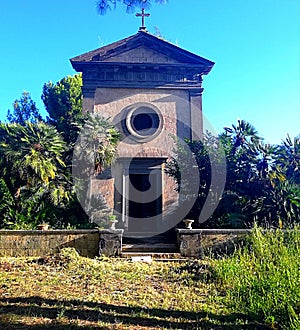 SEPTEMBER 28, 2019, Romanesque style church in a private garden surrounded by exotic palms and rare trees photo