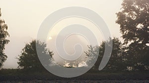 September sunrise over fields, autumn morning, sun, trees