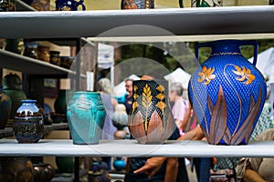 September 4, 2017 Woodside/CA/USA - Handcrafted colorful flower vases displayed at the Kings Mountain Art Fair located on Skyline