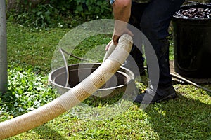 Septic tank: the cleaning of a domestic septic tank (MGW2057A1518)