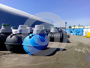 Septic tanks and other storage tanks at the manufacturer factory depot photo