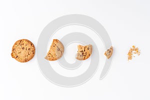 Sequence of chocolate chip cookies being devoured isolated on white background.