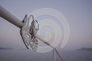 Sequin High-Heels on swimming platform.