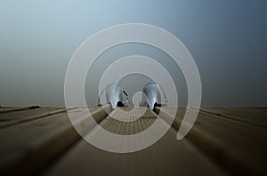 Sequin High-Heels on swimming platform.