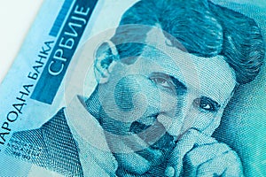 Serbian 100 dinara currency banknote, close up. Serbia money RSD dinar cash, macro view, portrait of scientist Nikola Tesla.