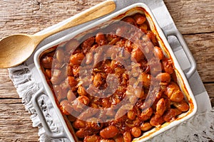 Serbian food: prebranac baked beans with onion close-up in baking dish. horizontal top view from above