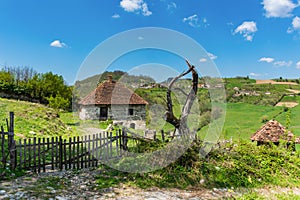 Serbian household on the mountain. Village house and wooden fence